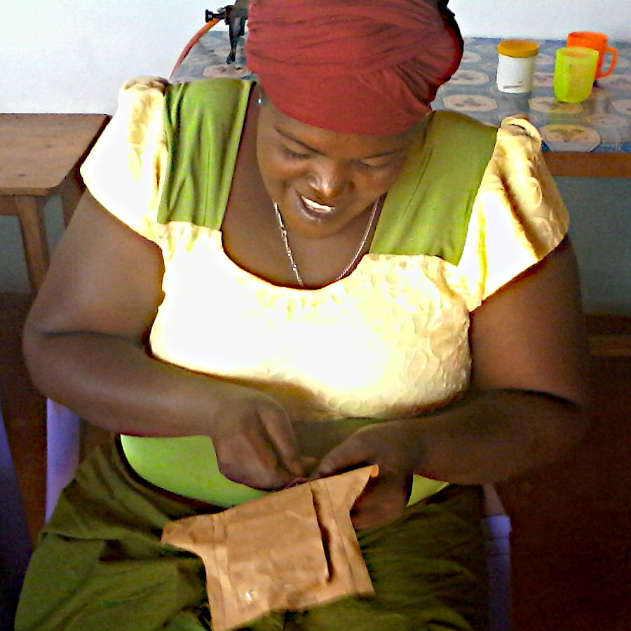 Kenyan woman making a sanitary pad