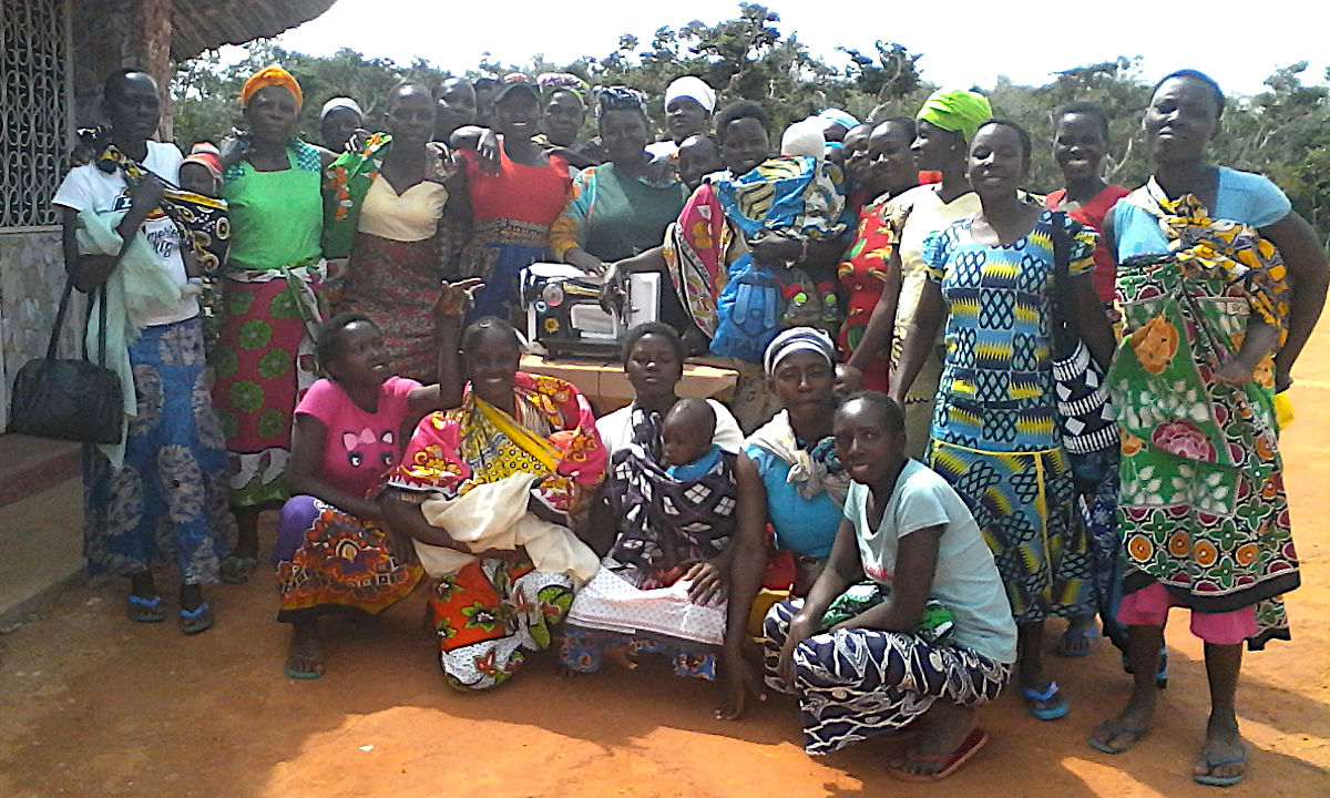 Mothers of the Forest with a sewing machine