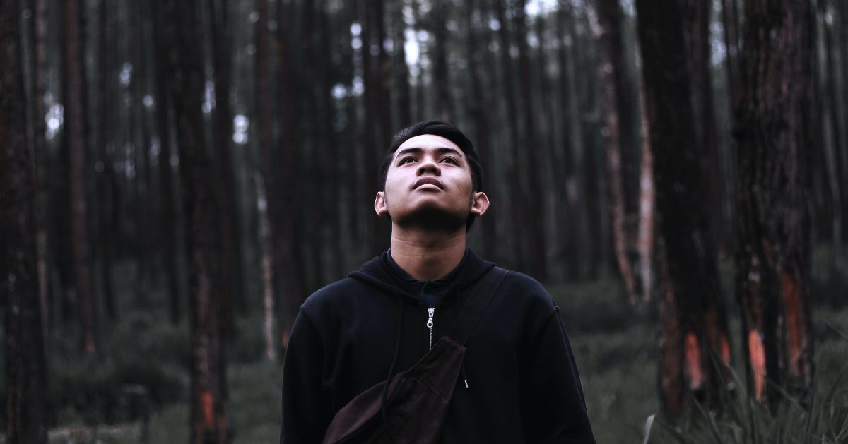 a man in the forest by Eris Setiawan on Unsplash