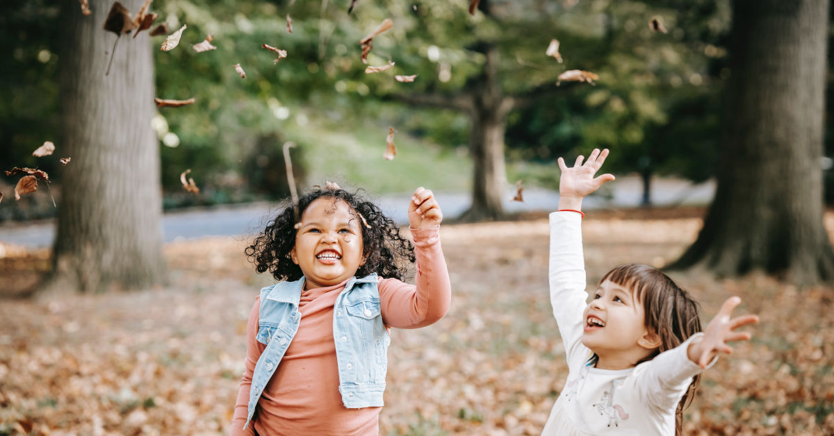 Excited children tossing leaves in park by Charles Parker on Pexels