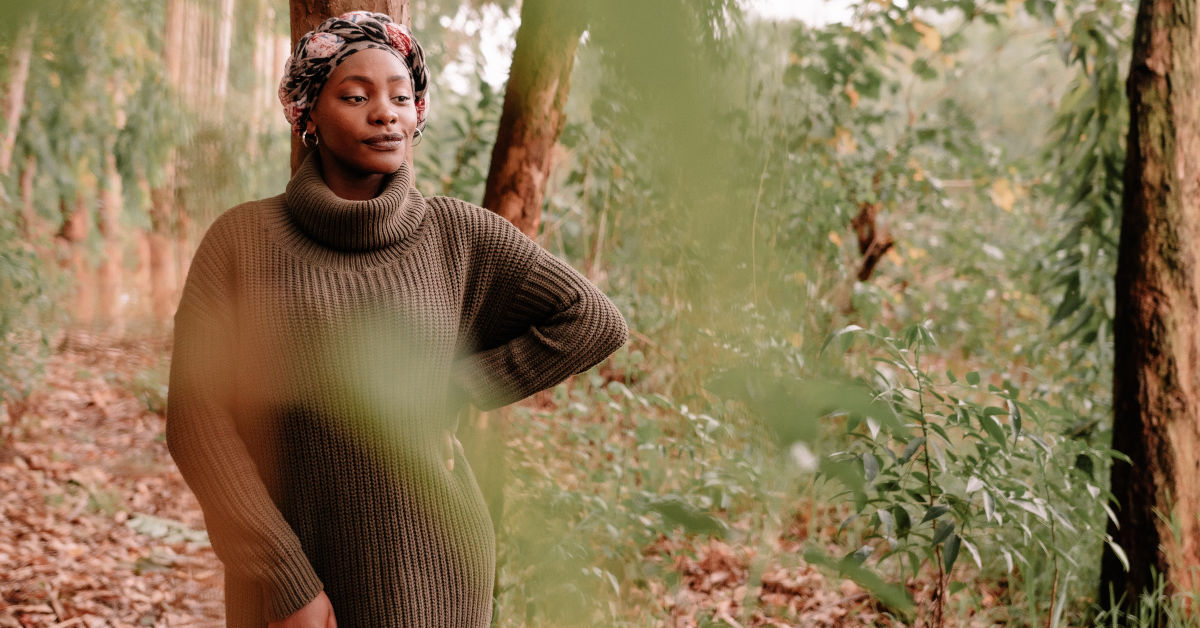 Thoughtful black woman in lush forest by Nicholas Githiri on Pexels