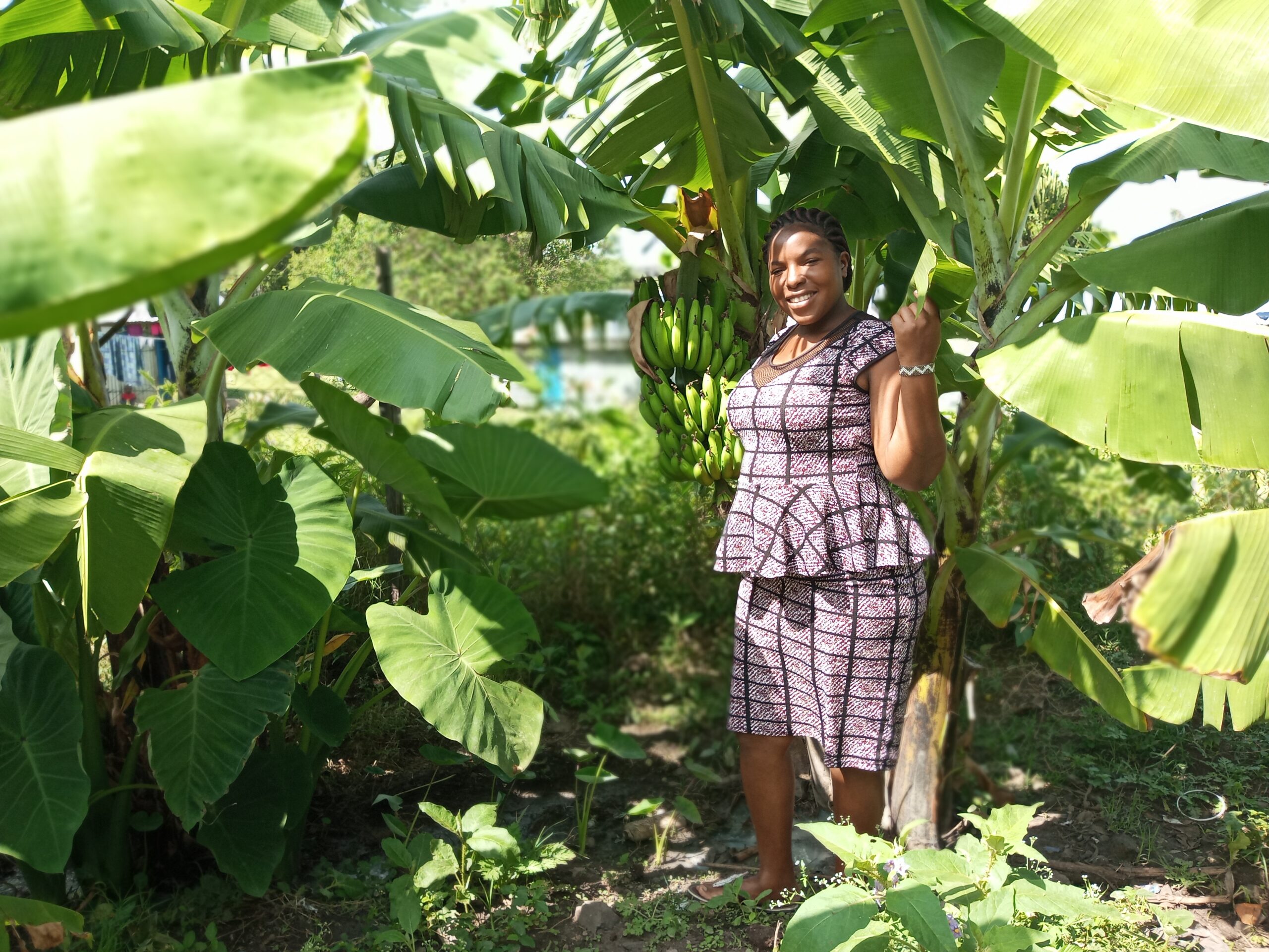 Joy by her banana tree