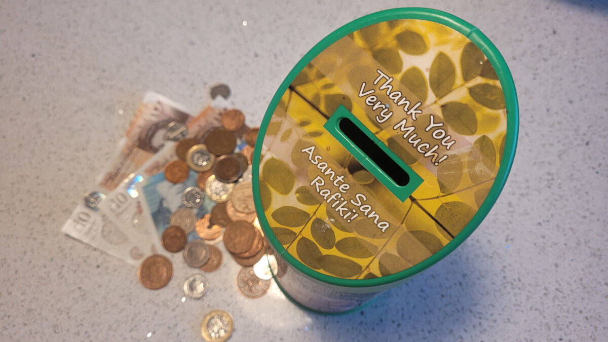 A collection tin with donations