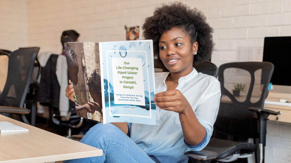 Mockup of a woman reading our water pipe booklet in an office